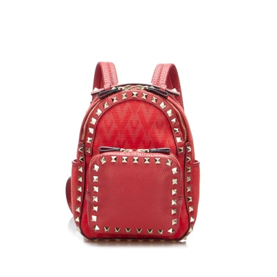 Shop Valentino Garavani Rockstud Red Canvas Backpack Bag ()