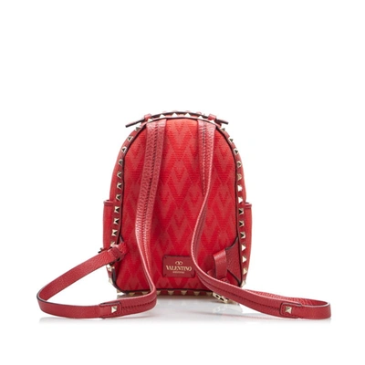 Shop Valentino Garavani Rockstud Red Canvas Backpack Bag ()