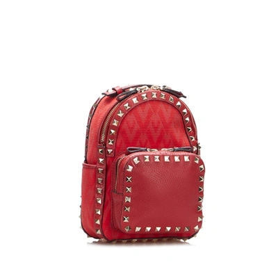 Shop Valentino Garavani Rockstud Red Canvas Backpack Bag ()