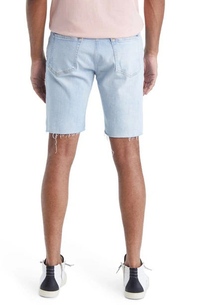 Shop Frame L'homme Cutoff Denim Shorts In Bates Rips
