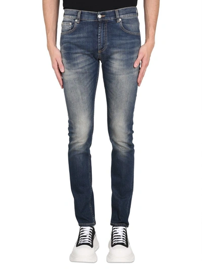 Shop Alexander Mcqueen Jeans With Graffiti Logo Embroidery In Blue