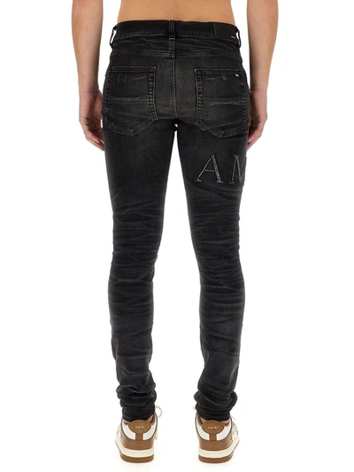 Shop Amiri Slim Fit Jeans In Black