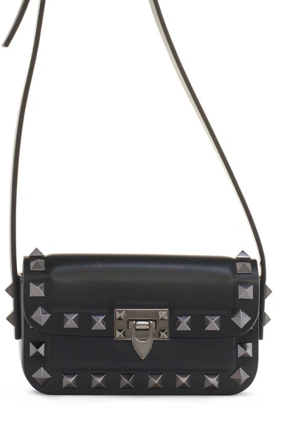 Shop Valentino Mini Rockstud23 Leather Crossbody Bag In 0no Nero