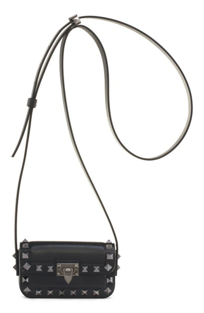 Shop Valentino Mini Rockstud23 Leather Crossbody Bag In 0no Nero
