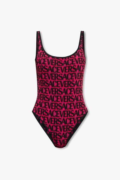 Shop Versace Pink Reversible Swimsuit In New