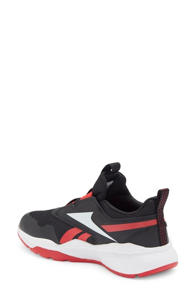 Shop Reebok Kids' Xt Sprinter Slip On Sneaker In Cblack/ Ftwwht/ Vecred