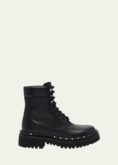 Shop Valentino Rockstud Leather Combat Boots In 0no Nero