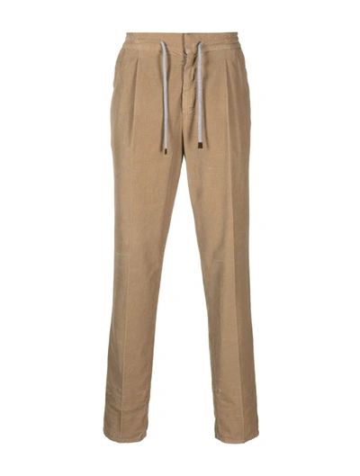 Shop Brunello Cucinelli Tapered Ribbed Trousers In Brown