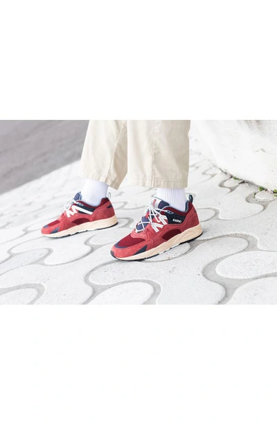 Shop Karhu Gender Inclusive Fusion 2.0 Sneaker In Mineral Red / Lily White