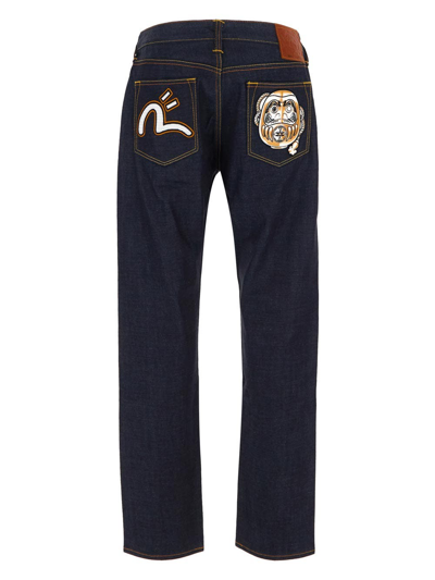 Shop Evisu Daruma Appliqué Carrot Fit Jeans In Blue