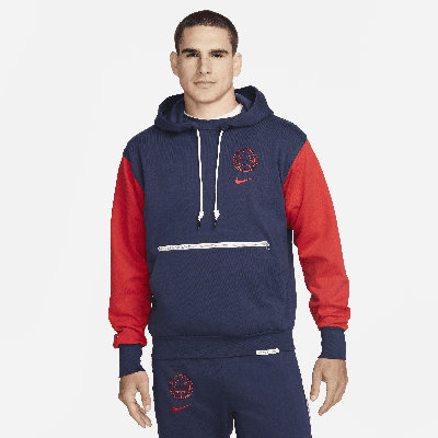 Shop Nike Paris Saint-germain Standard Issue  Men's Soccer Pullover Hoodie In Blue