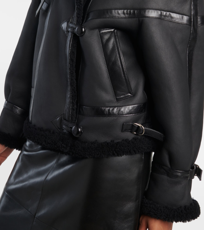 Shop Saint Laurent Leather And Shearling Jacket In Black