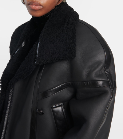 Shop Saint Laurent Leather And Shearling Jacket In Black