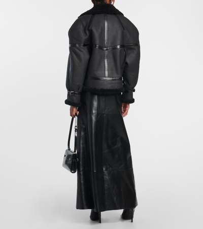 Shop Saint Laurent Leather And Shearling Jacket In Black