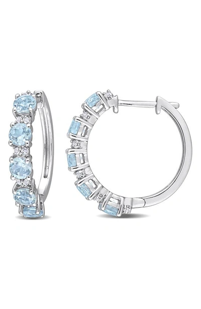 Shop Delmar Sterling Silver Sky Blue Topaz & White Topaz Huggie Hoop Earrings