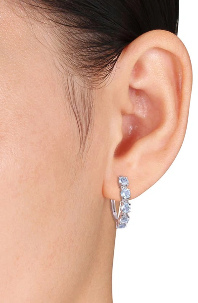 Shop Delmar Sterling Silver Sky Blue Topaz & White Topaz Huggie Hoop Earrings