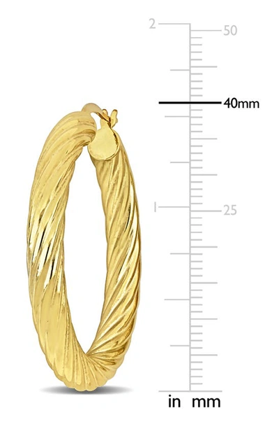 Shop Delmar 40mm Twist Hoop Earrings In Gold