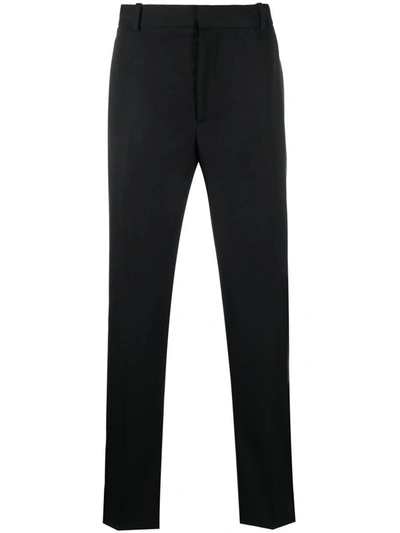 Alexander Mcqueen Black Jeans With Logo Patch On The Rear And Worn Out Effect In Denim Man In Black