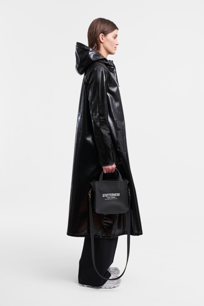 Shop Stutterheim Mosebacke Long Opal Raincoat In Black