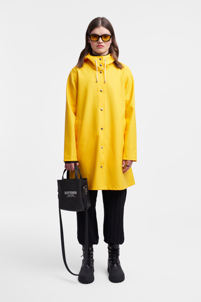 Shop Stutterheim Mosebacke Raincoat In Yellow