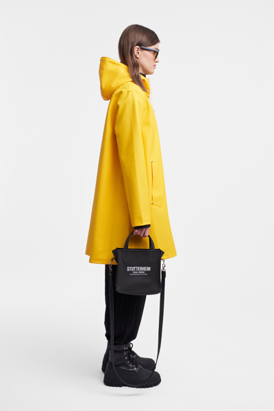 Shop Stutterheim Mosebacke Raincoat In Yellow