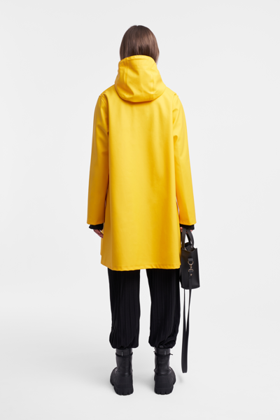 Shop Stutterheim Mosebacke Raincoat In Yellow