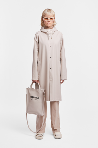 Shop Stutterheim Stockholm Long Raincoat In Light Sand