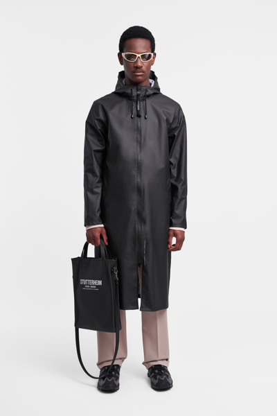 Shop Stutterheim Stockholm Long Lightweight Zip Raincoat In Black