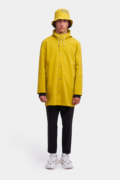 Shop Stutterheim Stockholm Lightweight Matte Raincoat Gold In Golden Palm