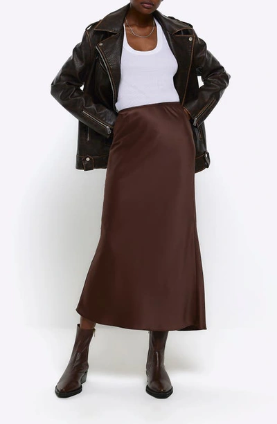 Shop River Island Bias Cut Satin Skirt In Brown
