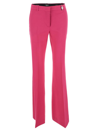 Shop Versace Flared Trousers In Pink