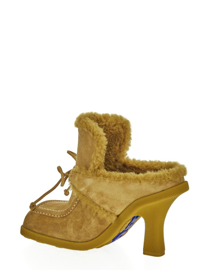 Shop Burberry Highland Mules In Yellow