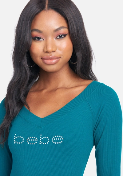 Shop Bebe Crystal Logo Long Sleeve Dress In Storm Green