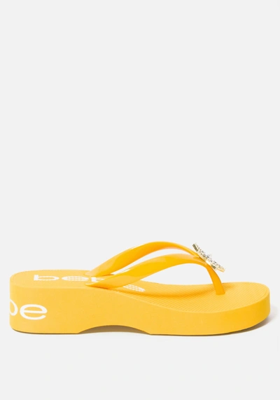 Shop Bebe Kim Wedge Flip Flops In Yellow