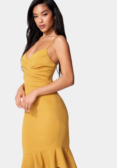 Shop Bebe Angled Flounce Midi Dress In Mustard