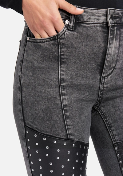Shop Bebe Acid Wash Stud Detail Skinny Jeans In Black Acid Wash