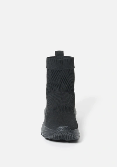 Shop Bebe Aspen Sneakers In Black Flyknit
