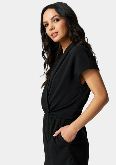 Bebe Surplice Romper In Black