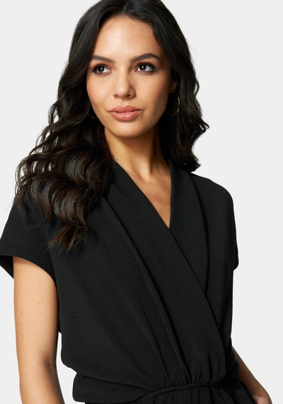 Shop Bebe Surplice Romper In Black