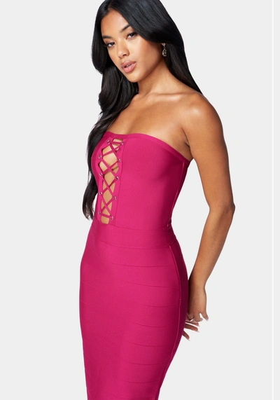 Bebe Bandage Lace-up Strapless Dress In Fuchsia Red