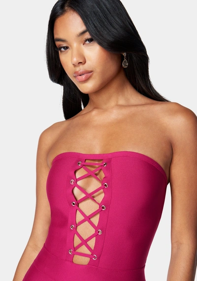 Bebe Bandage Lace-up Strapless Dress In Fuchsia Red