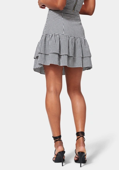 Shop Bebe Mini Gingham Front Ruching Flutter Skirt In Black,white Alyssum