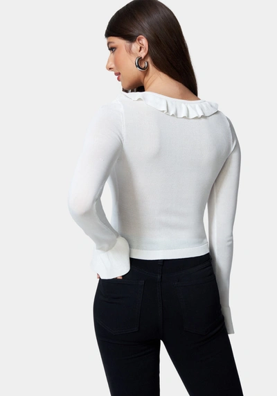 Shop Bebe Ruffle Cropped Sweater Cardigan In White Alyssum