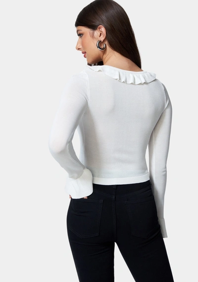 Bebe Ruffle Cropped Sweater Cardigan In White Alyssum