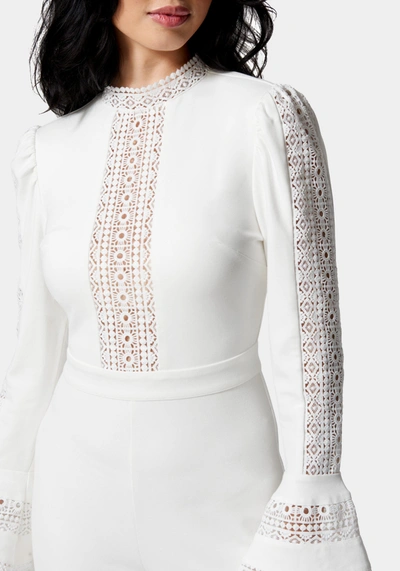 Bebe Ruffle Bell Sleeve Romper In Ivory