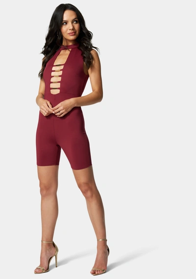 Shop Bebe Caged Biker Short Romper In Marsala