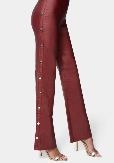 Bebe Wide Leg Snap Detail Coated Denim Jumpsuit In Bloodstone