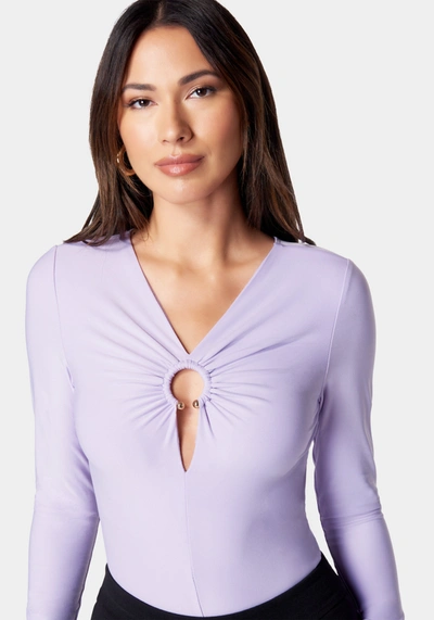 Shop Bebe Ring Detail Long Sleeve Bodysuit In Lavender