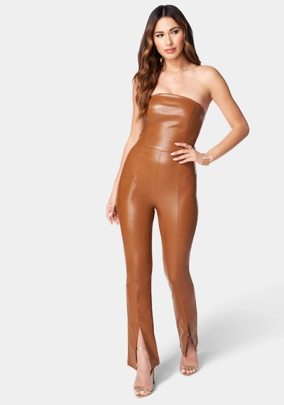 Shop Bebe Split Hem Strapless Vegan Leather Jumpsuit In Copper Brown