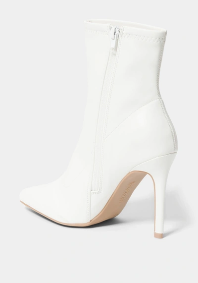 Shop Bebe Kandey Boots In White Faux